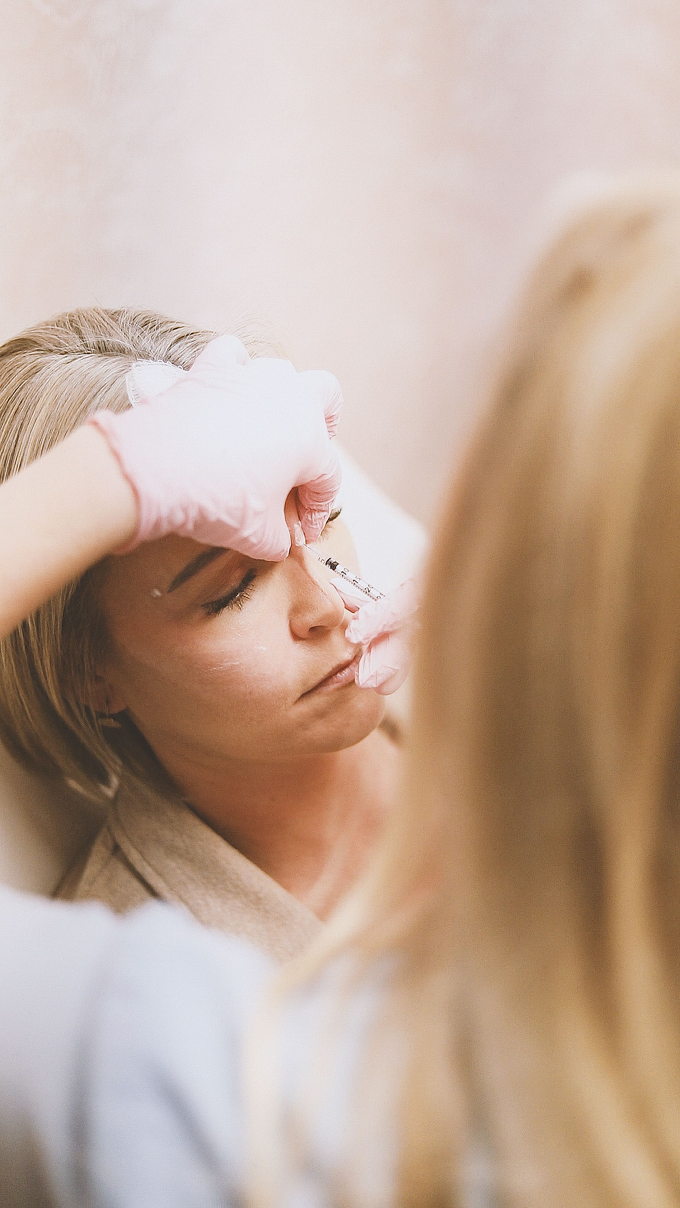 Close-up of a fine injection near the eye area, representing under-eye wrinkle treatment at Bailor Clinic in Sinsa, Gangnam