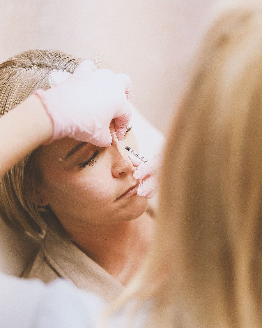 Close-up of a fine injection near the eye area, representing under-eye wrinkle treatment at Bailor Clinic in Sinsa, Gangnam