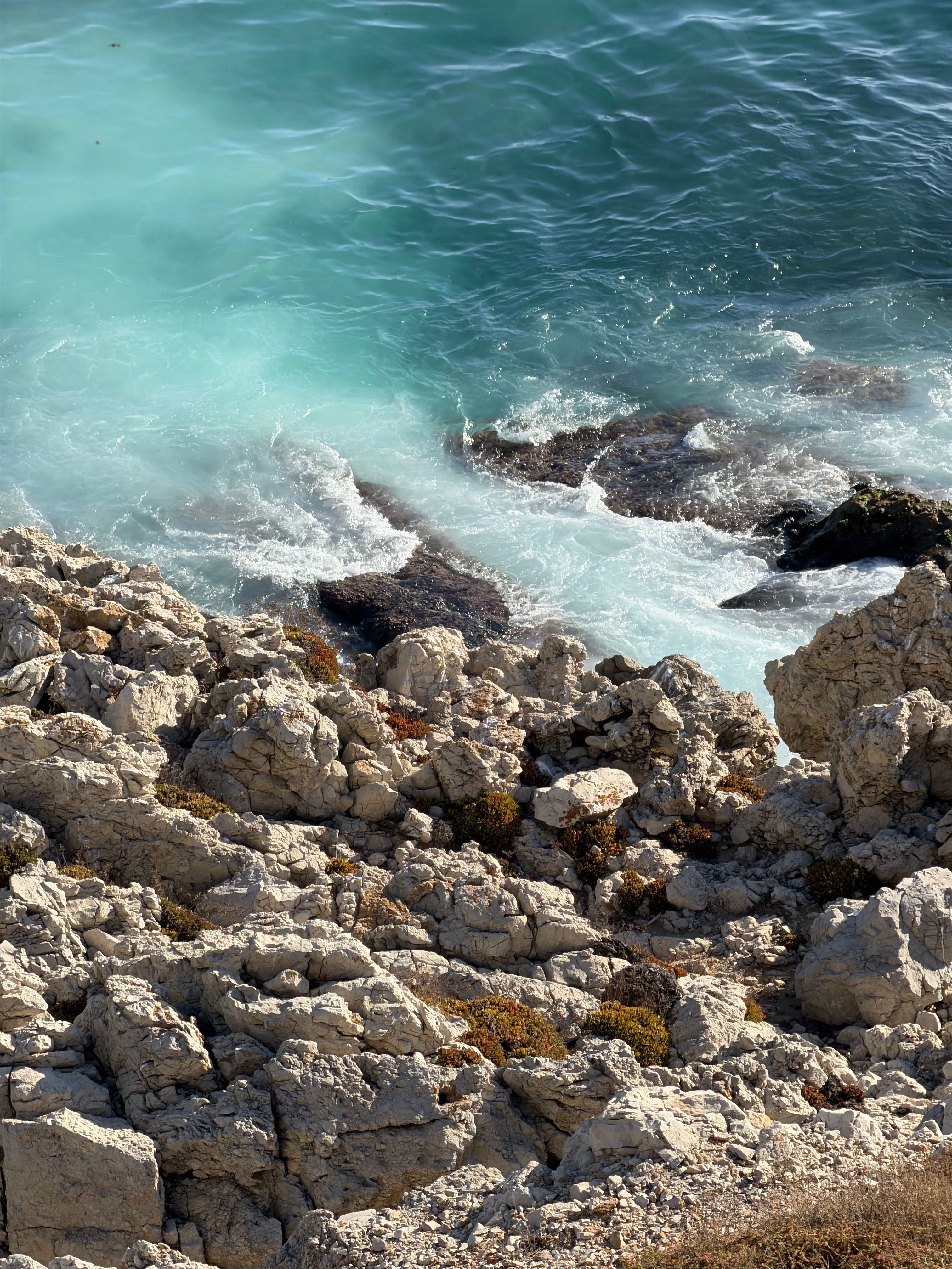 Rocky Coastal Shoreline with Turquoise Water · Free Stock Photo