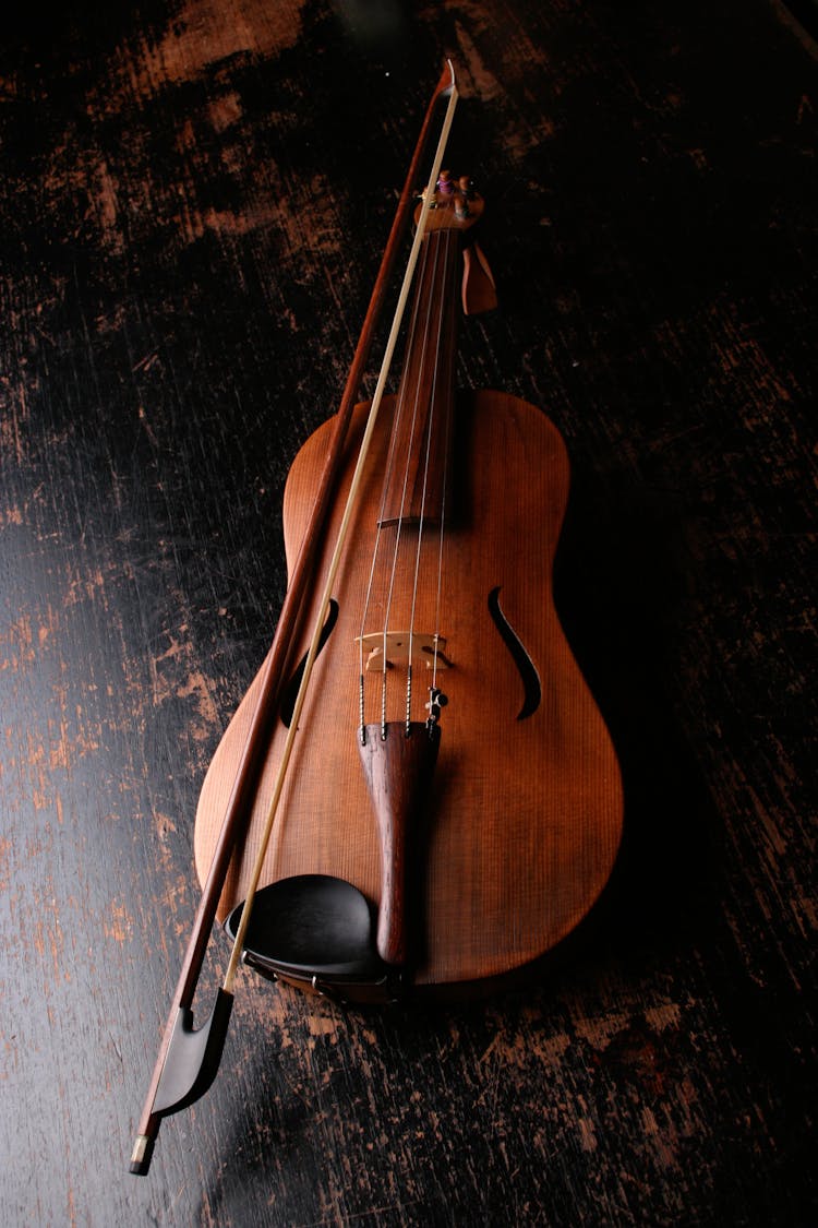 Brown Wooden Violin And Violin Bow