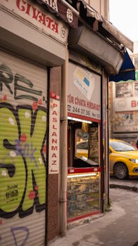 A hardware store and street view in Istanbul, Turkey with urban graffiti and shop signs.