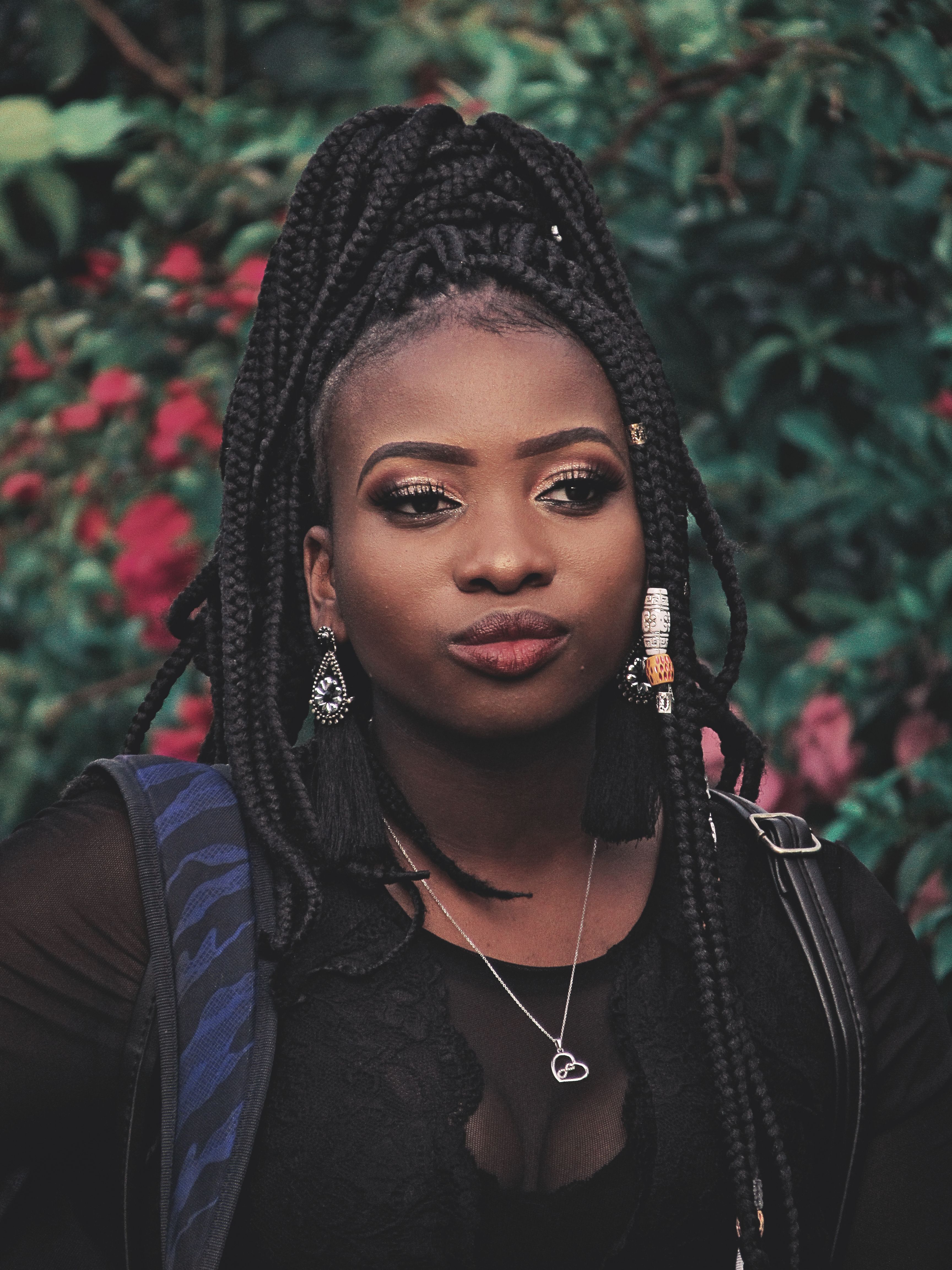 Portrait of an African Woman with Braids Outdoors · Free Stock Photo