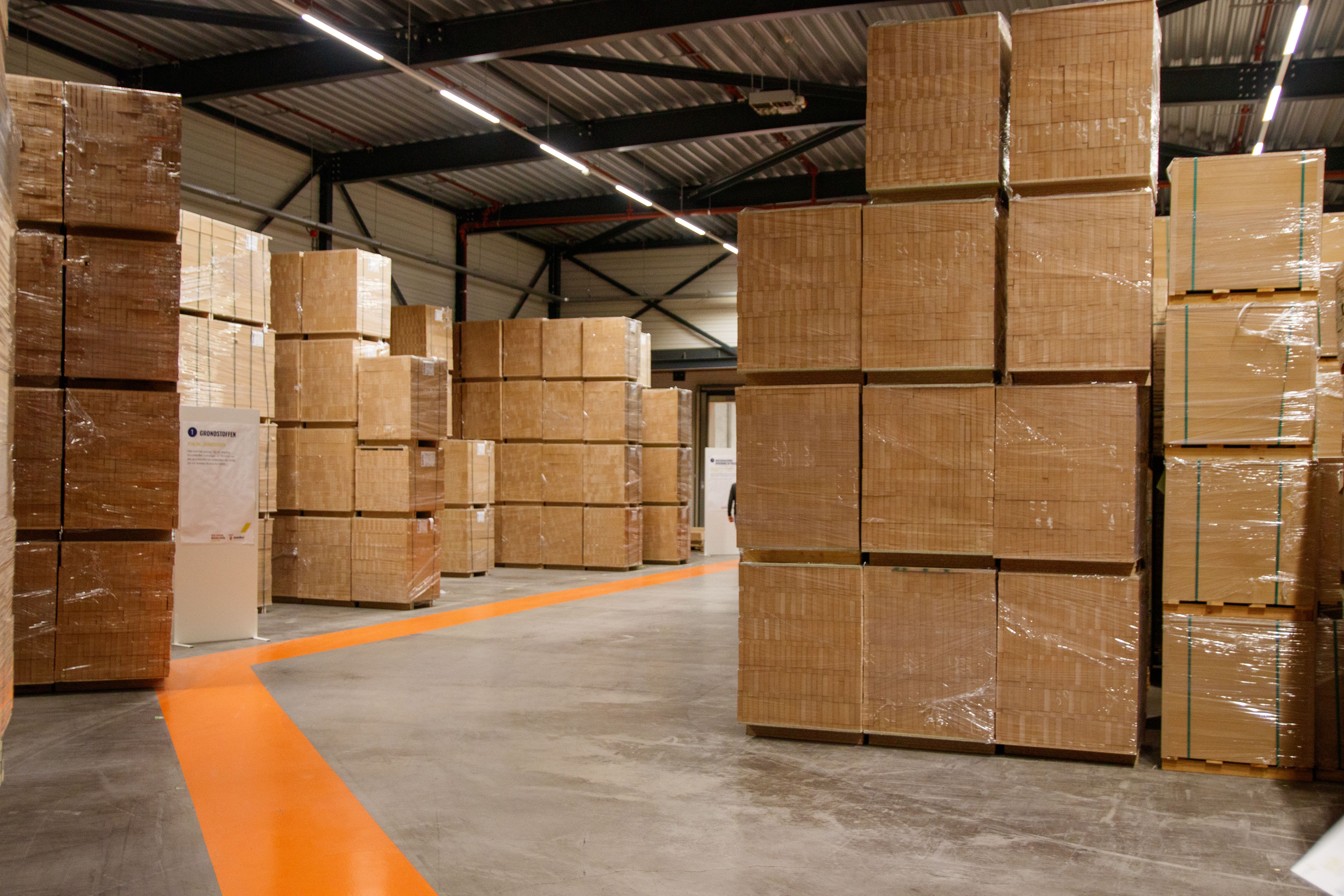 Illustrative warehouse with boxed stock ready for dispatch