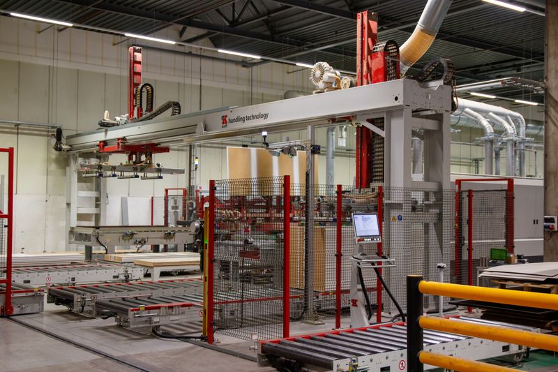 Industrial machinery with robotic arm in a modern manufacturing facility