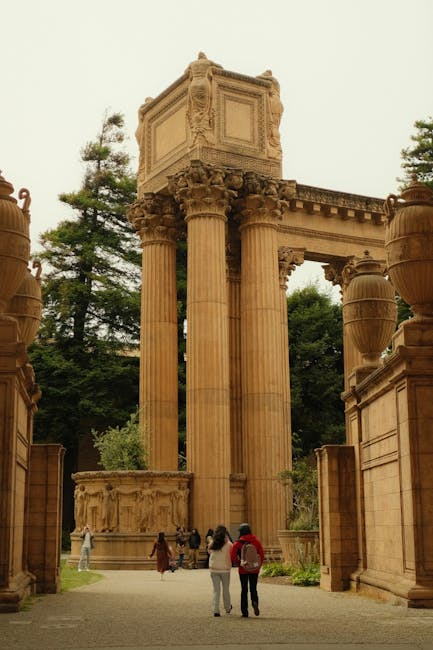 Tourists exploring the iconic Palace of Fine Arts amidst lush greenery.