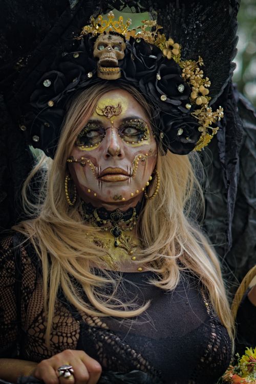 Free Intricate gothic-themed makeup and costume with ornate headdress and detailed face art. Stock Photo