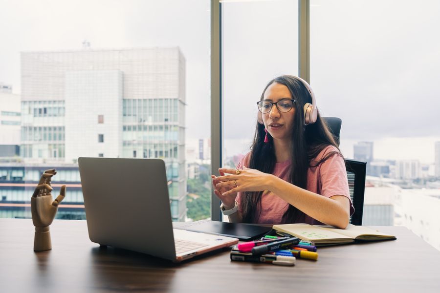 Recorded customer interview — a researcher on a video call at her desk, photo by Julio Lopez on Pexels