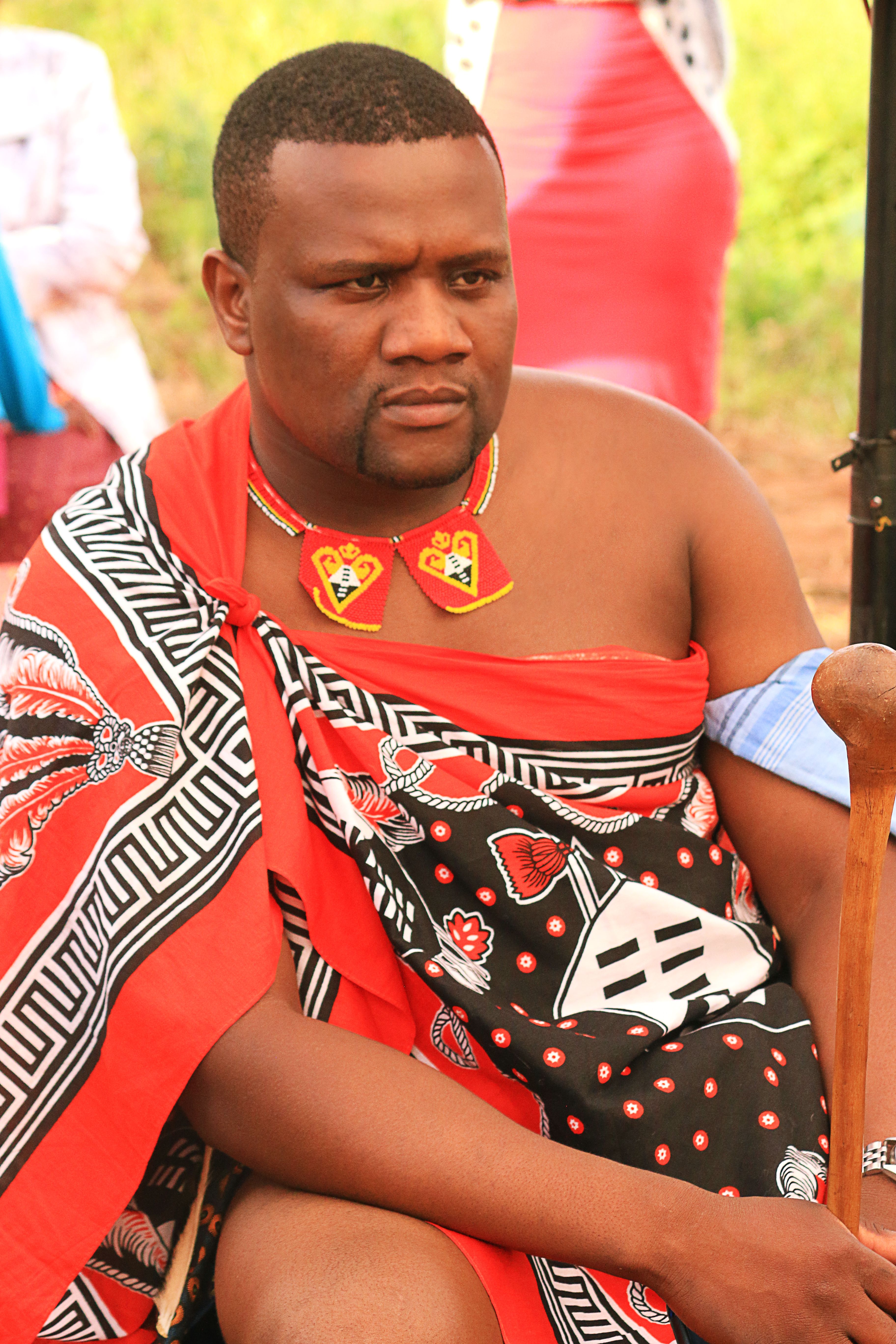 Man in traditional Swazi attire participates in a cultural event in Nhlangano, Eswatini.