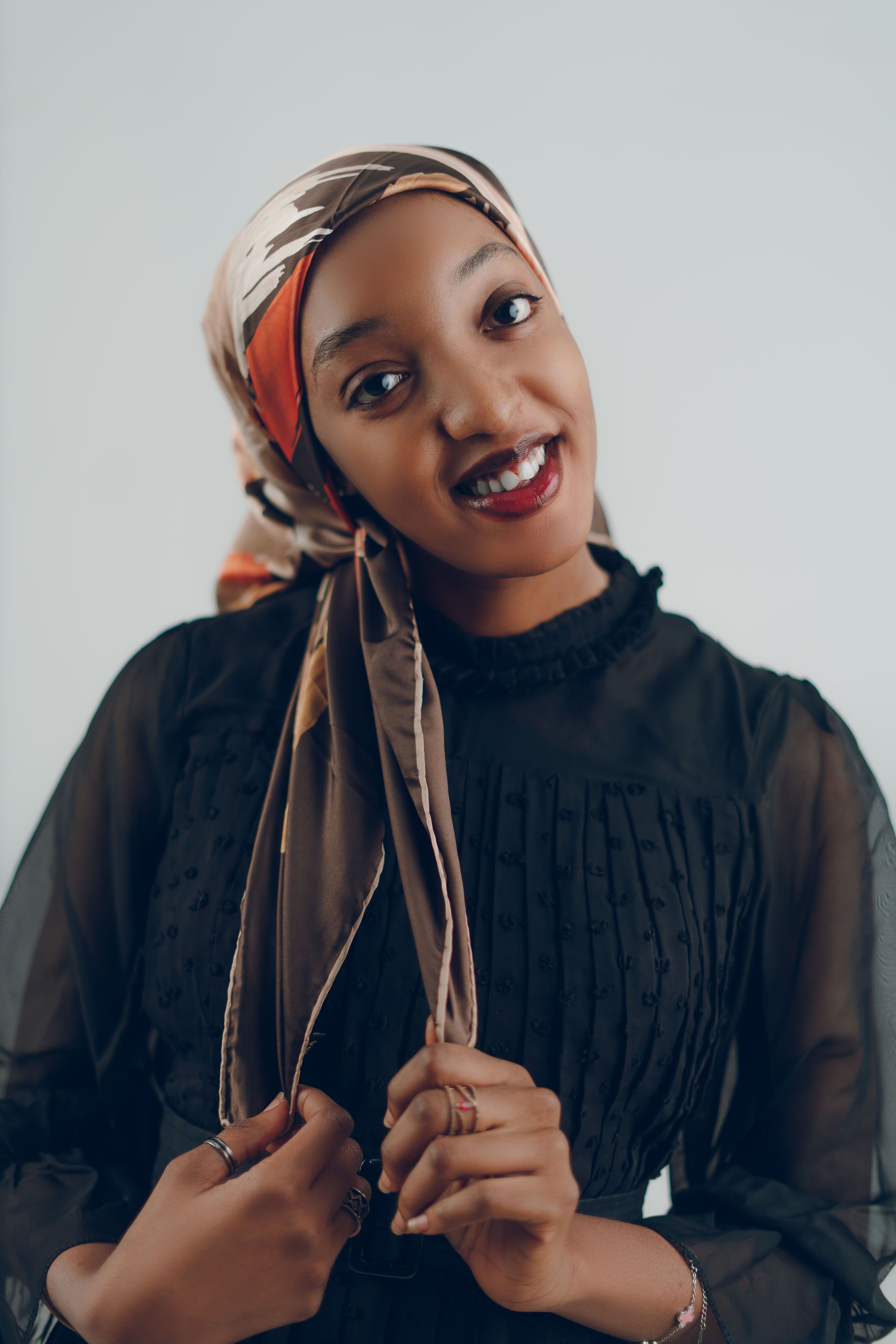 Smiling Young Woman in Elegant Headscarf Portrait · Free Stock Photo