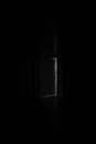 Ajar Door in Dark Interior
