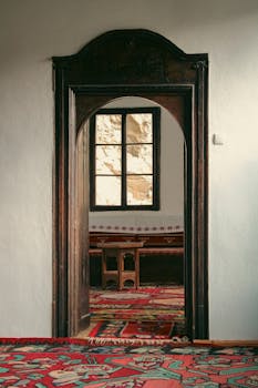 Explore the elegant interior of a Bosnian building with a beautifully carved wooden doorway.
