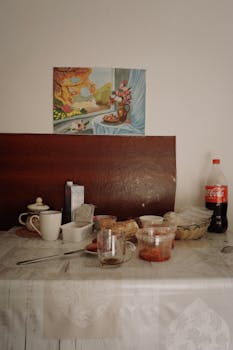Warm breakfast scene in a kitchen with coffee and snacks in Almaty, Kazakhstan.