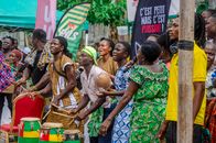 Colorful African festival featuring lively drumming and dancing performers in traditional attire.
