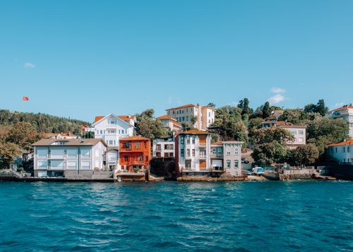 Free Charming waterfront houses line the Bosphorus, showcasing Istanbul's vibrant architecture. Stock Photo