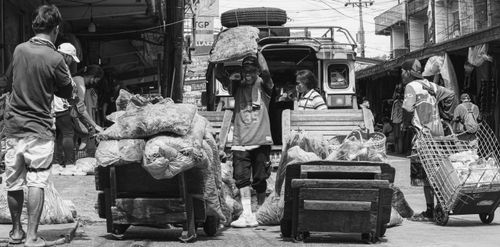Free A vibrant black and white market scene capturing vendors and porters in Baguio, Philippines. Stock Photo
