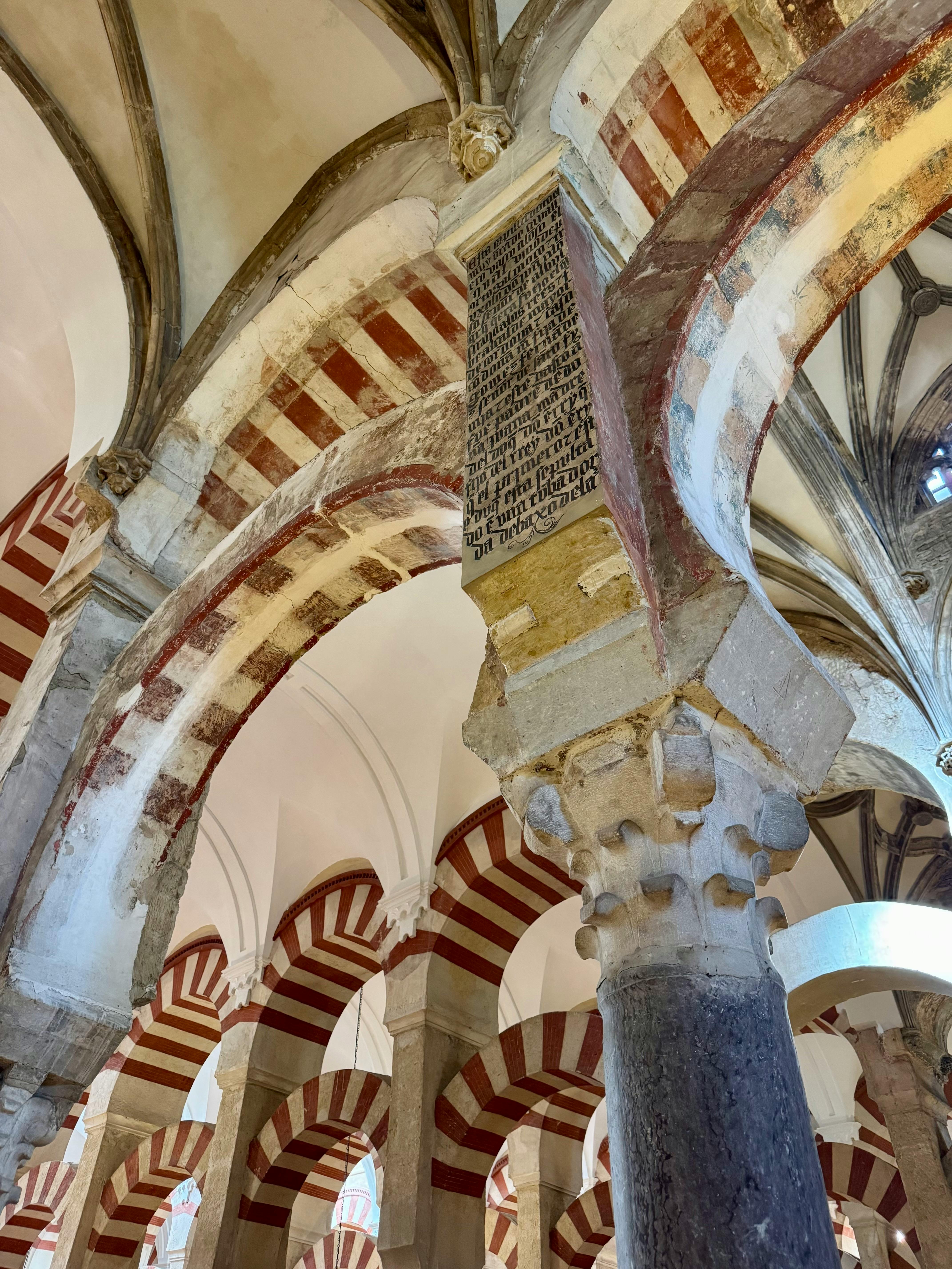Captivating details of the historical Mosque-Cathedral of Córdoba, featuring stunning archways.