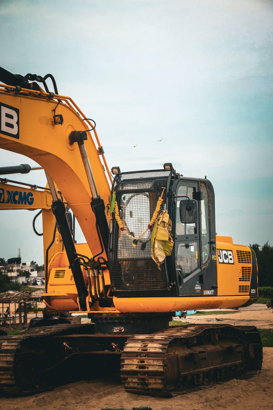 Tracked excavator working beside a trench