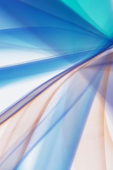Dynamic abstract composition with blue and orange light streaks creating a vibrant pattern.