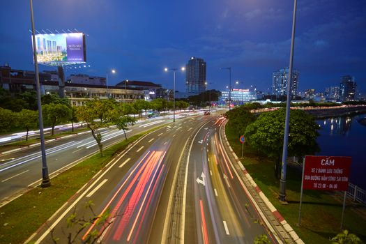 Long exposure of night traffic flows through the streets of Ho Chi Minh City, Vietnam.
