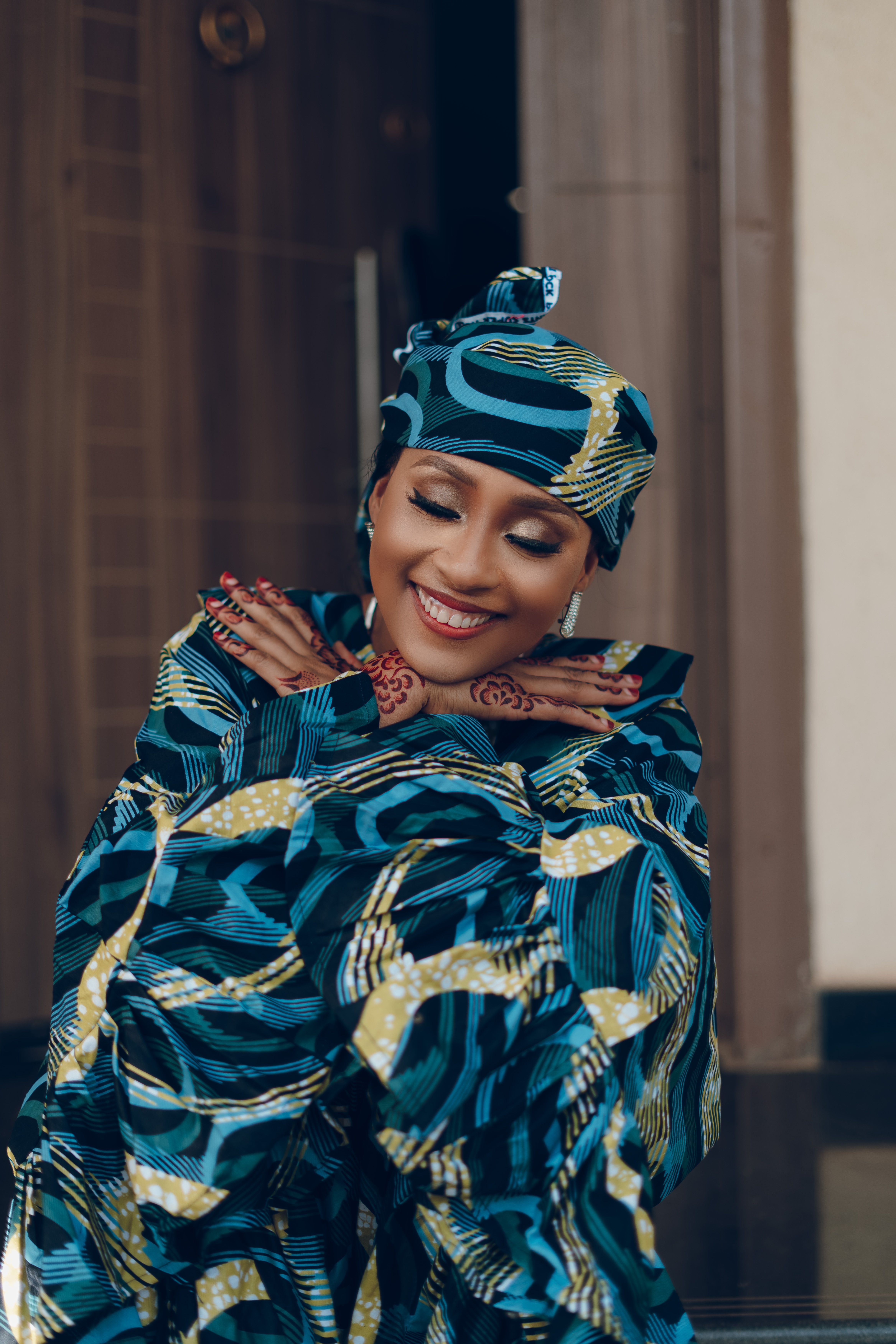 Smiling Woman in African Traditional Attire · Free Stock Photo