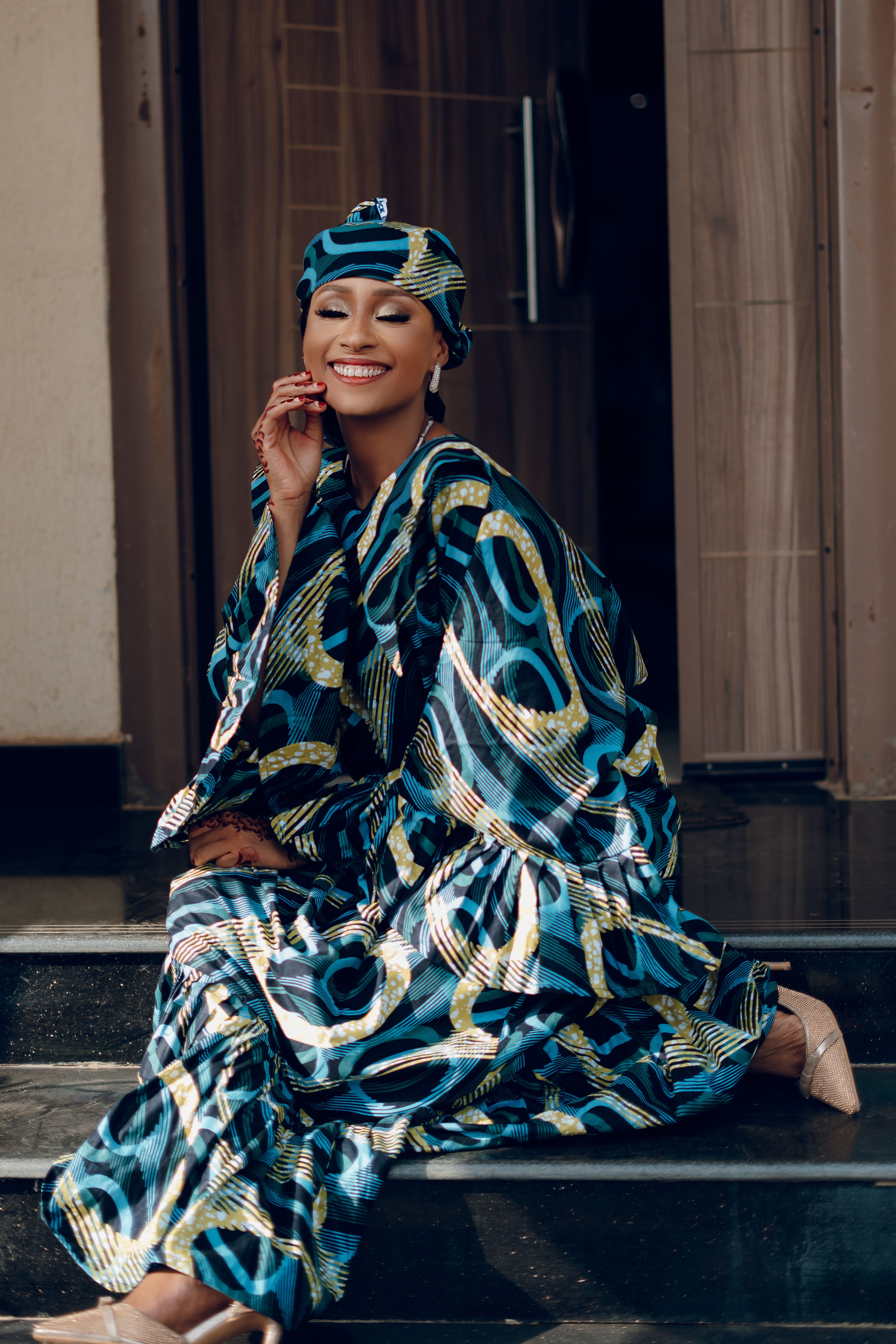 Elegant Woman in Traditional African Attire Smiling · Free Stock Photo