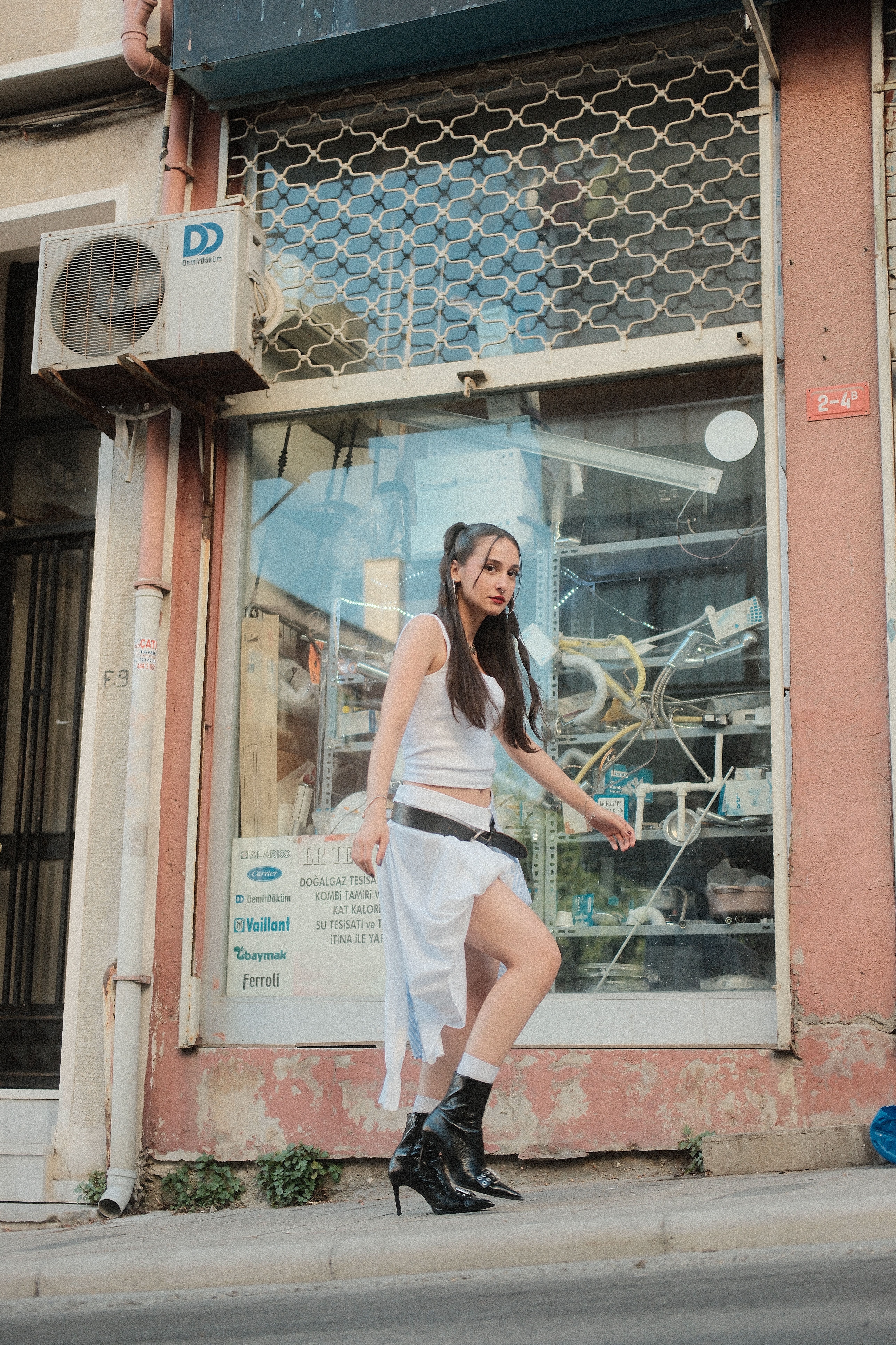 Fashionable Woman Walking in Urban Street Scene · Free Stock Photo