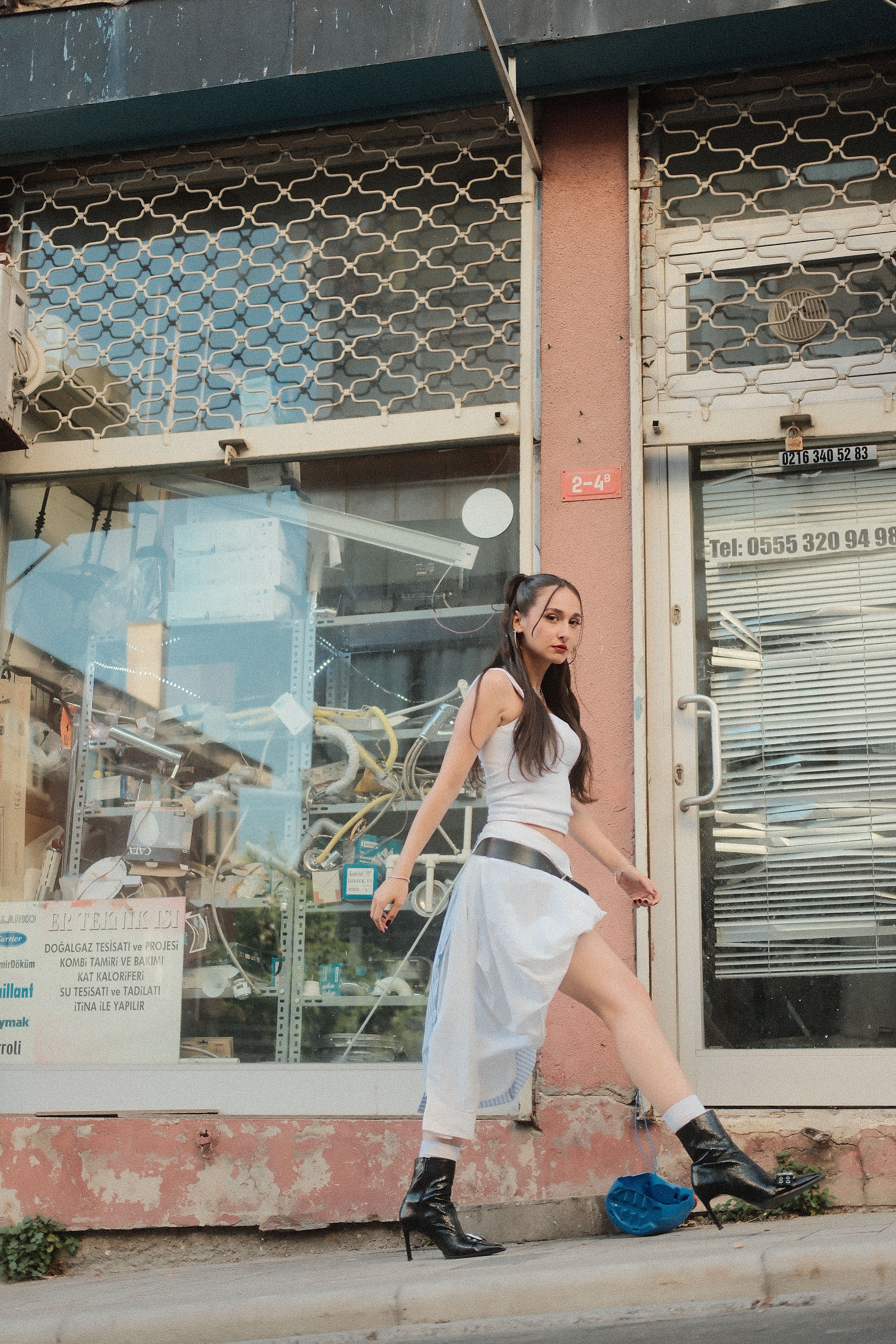 Stylish Woman Walking in Urban Street Setting · Free Stock Photo