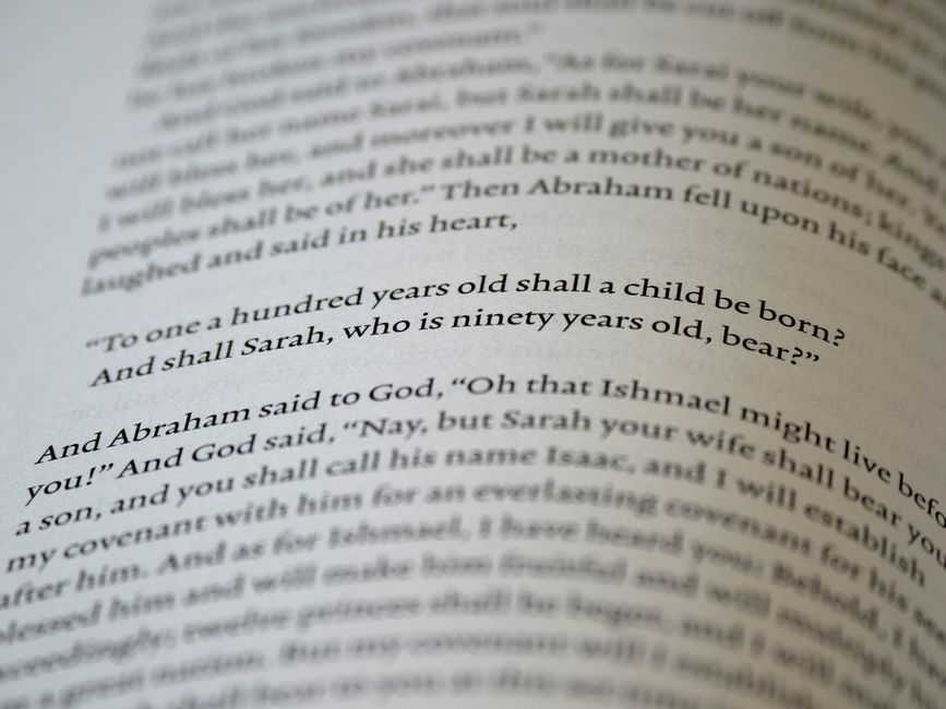 Close-up of text from the Book of Genesis in the Bible.