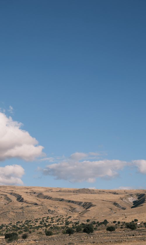 Free A serene landscape showcasing wide open skies above expansive rolling hills. Stock Photo