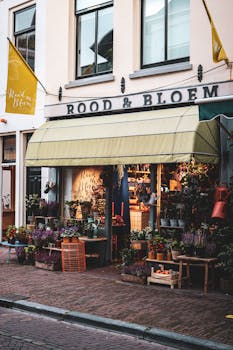 Picturesque flower shop with a colorful display of plants and cheerful awning.