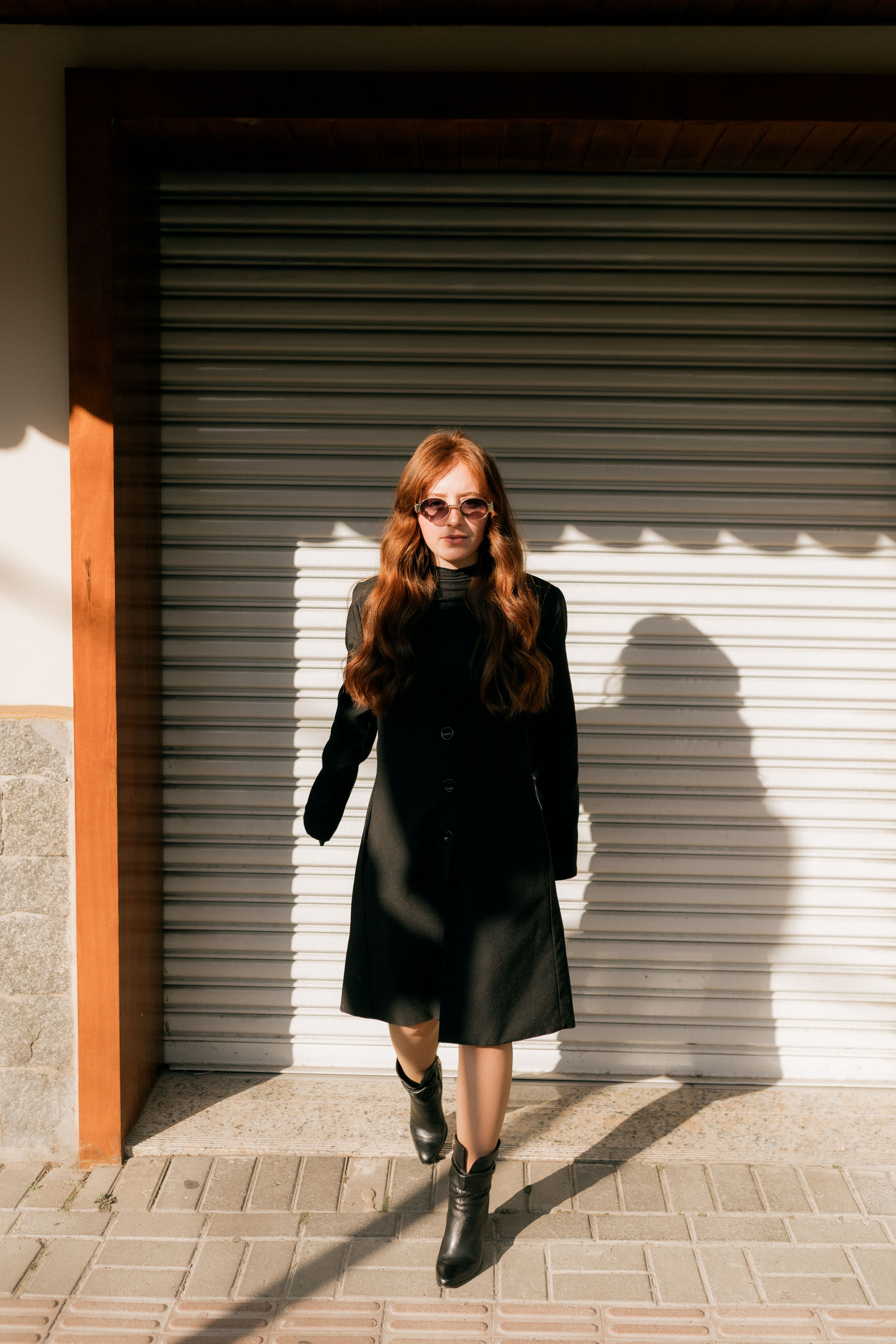 Stylish Woman in Black Coat on Sunny Day · Free Stock Photo