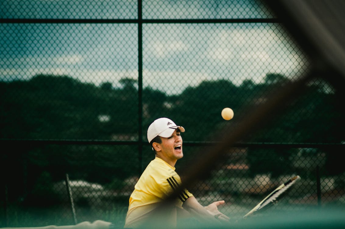 Free Man Playing Tennis Stock Photo
