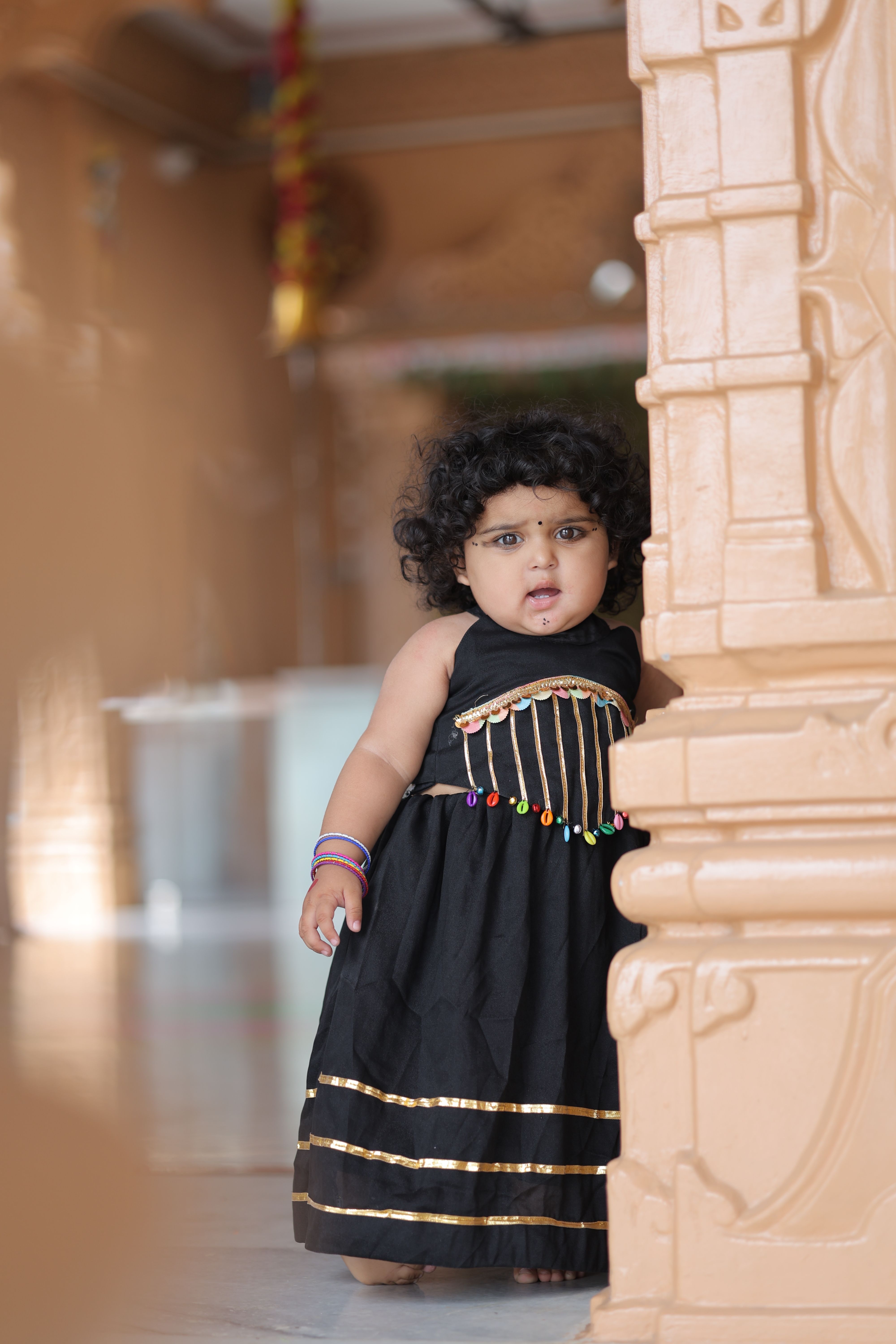 Cute Toddler in Traditional Black Dress Indoors  Free Stock Photo
