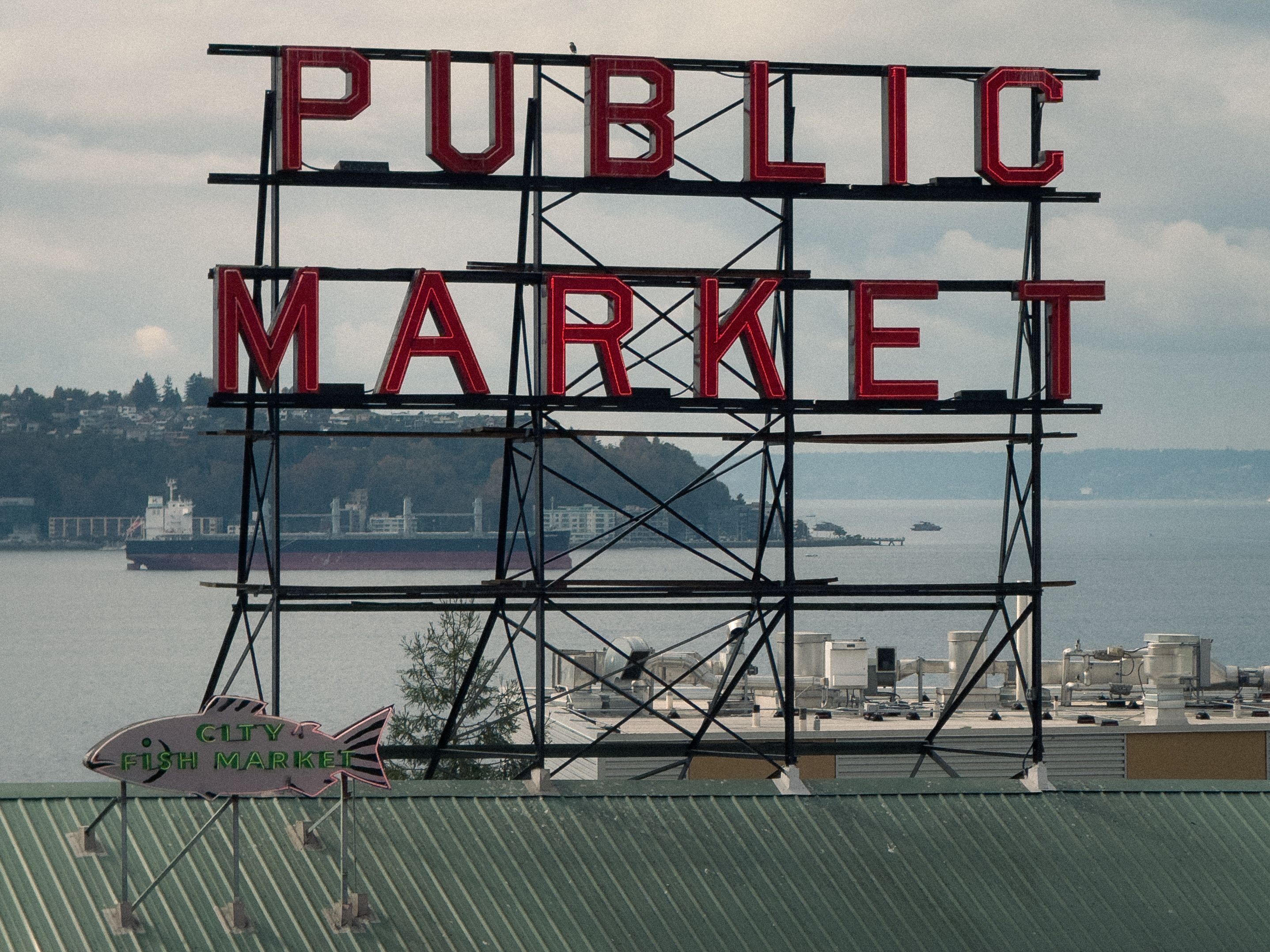 Classic view of Seattle's famous Public Market sign overlooking the bay. Classic view of Seattle's famous Public Market sign overlooking the bay.