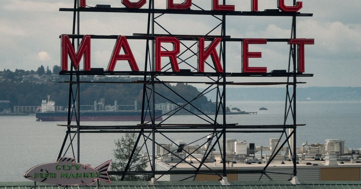 Seattle Destination Sign Iconic Seattle Public Market Sign with Bay View · Free Stock Photo