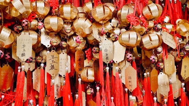 Close-up of golden temple ornaments and red tassels at Wong Tai Sin Temple in Kowloon, Hong Kong.