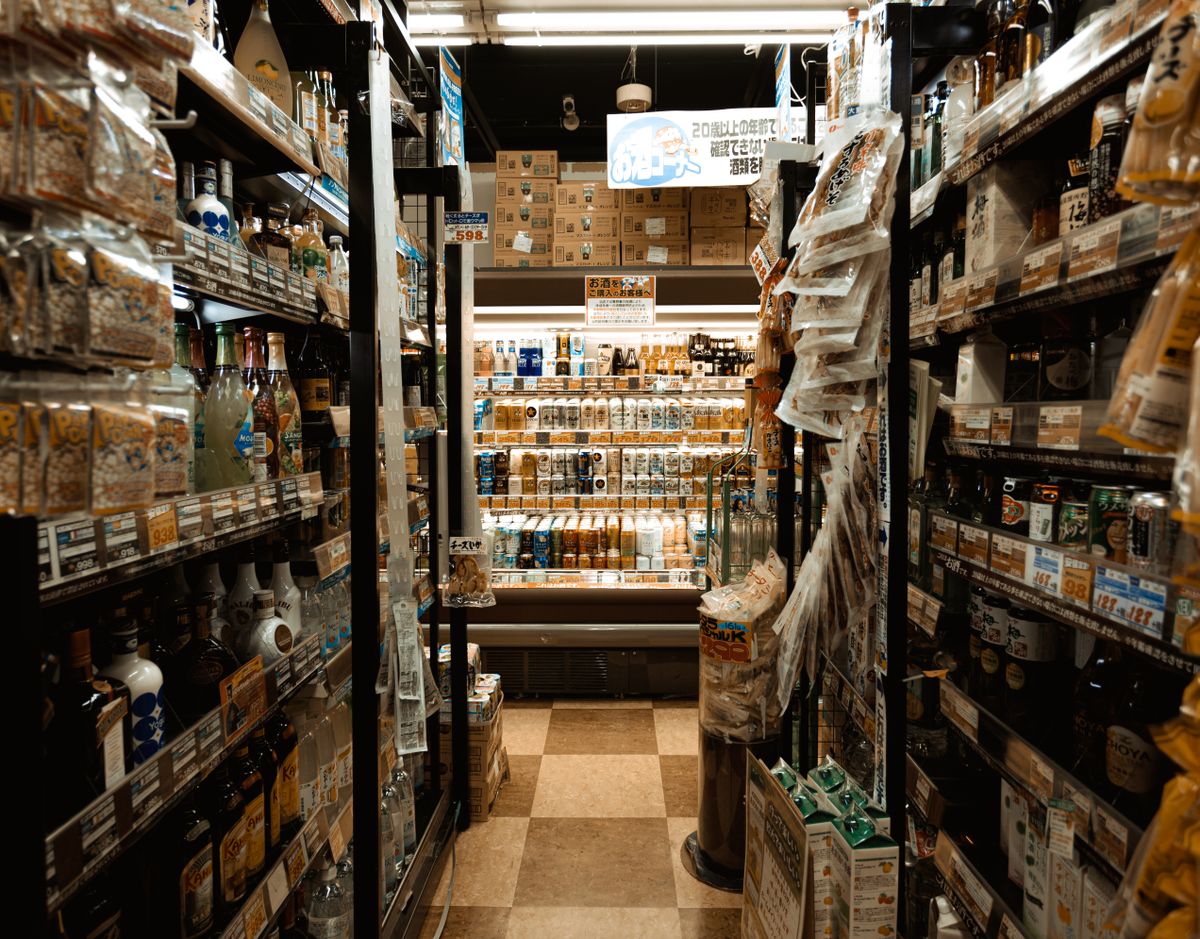 Shelves of packaged food inside a Japanese convenience store