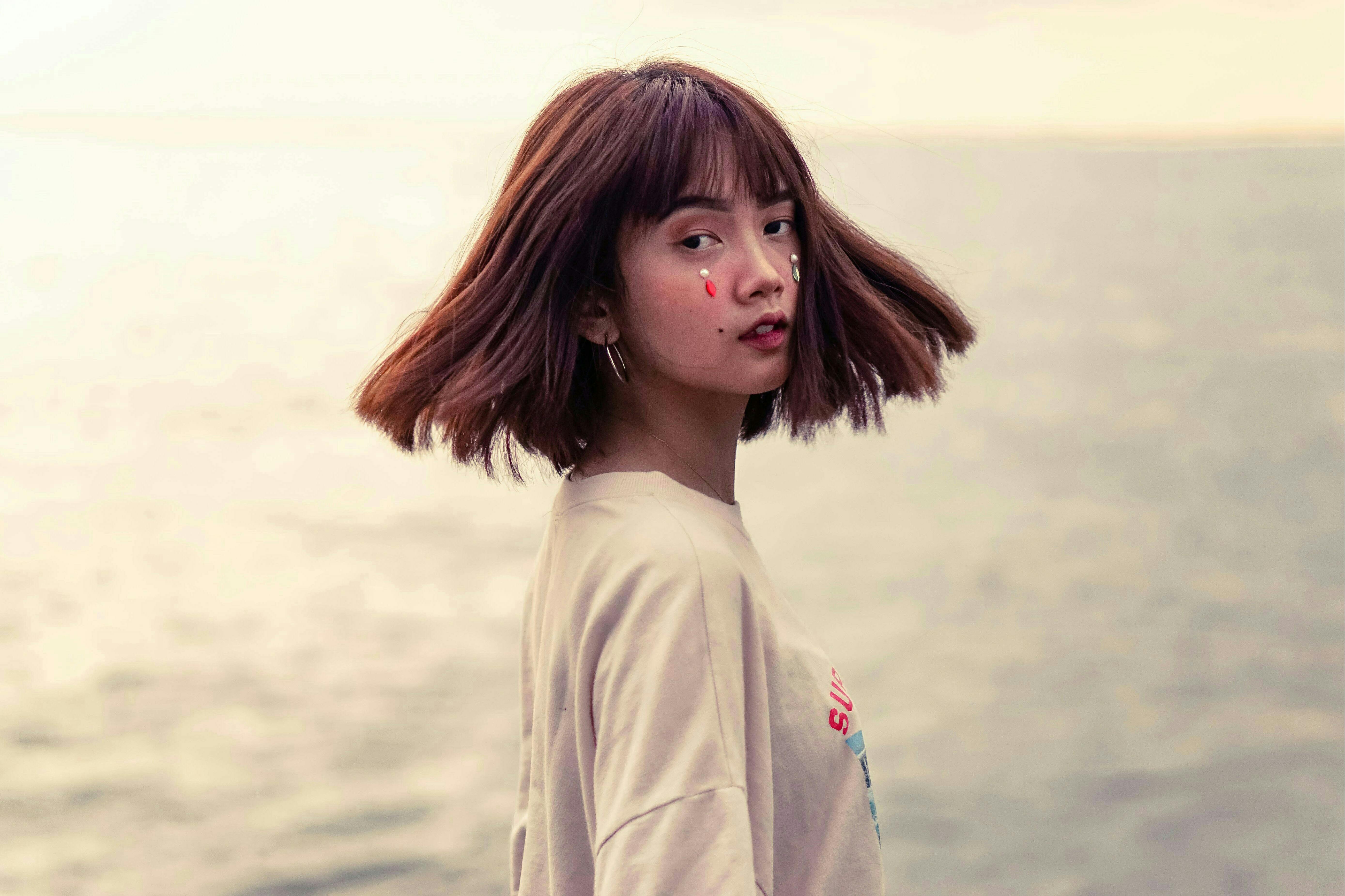 person looking thoughtfully at the ocean - christian rehab centers