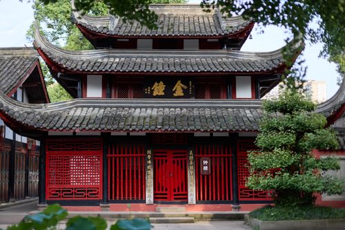 Free A beautiful traditional Chinese building with intricate architecture surrounded by greenery. Stock Photo