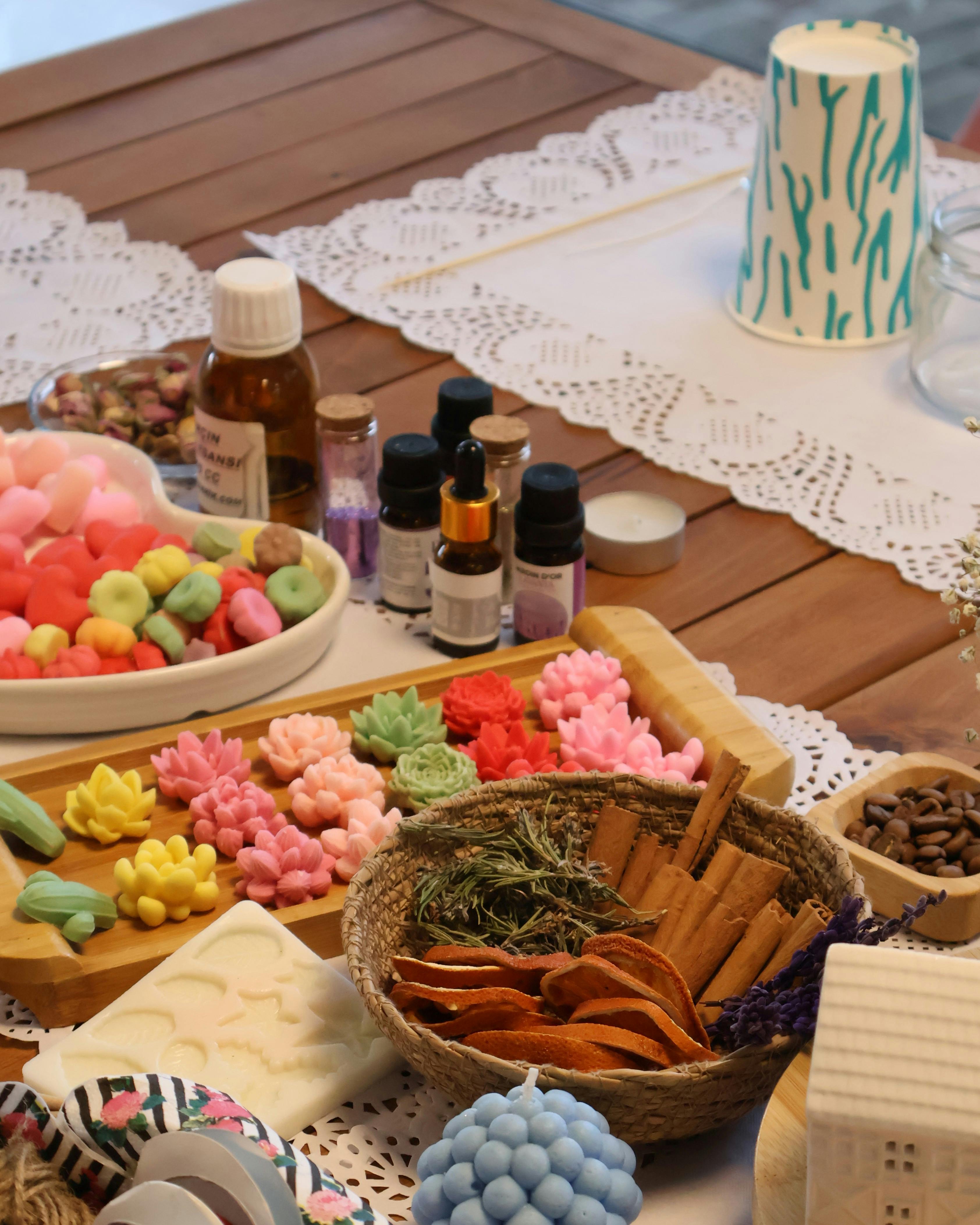 Vibrant craft supplies including soap molds and essential oils for creative DIY projects.