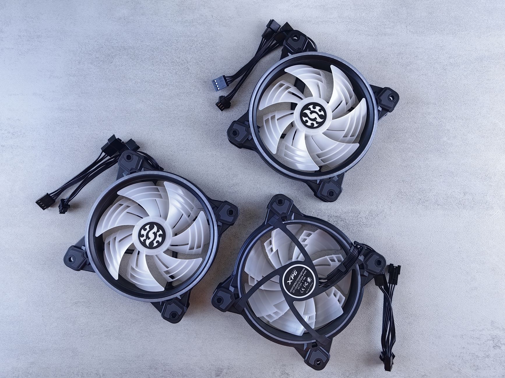 Top view of three high-performance cooling fans for computers with sleek design.