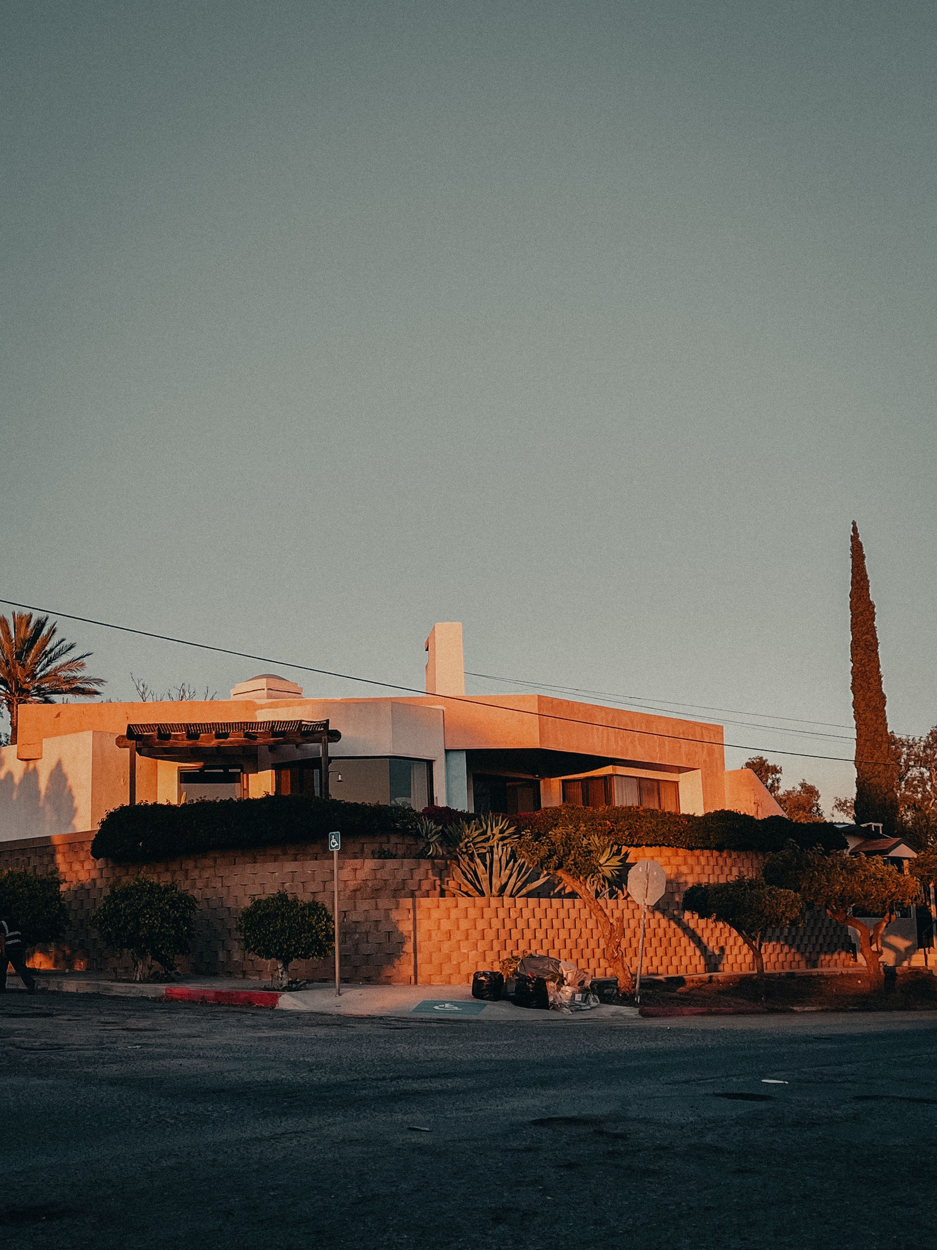 Stylish suburban house with unique architecture at sunset