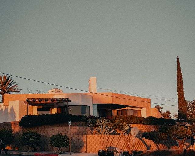 Home ready to sell Stylish suburban house with unique architecture at sunset