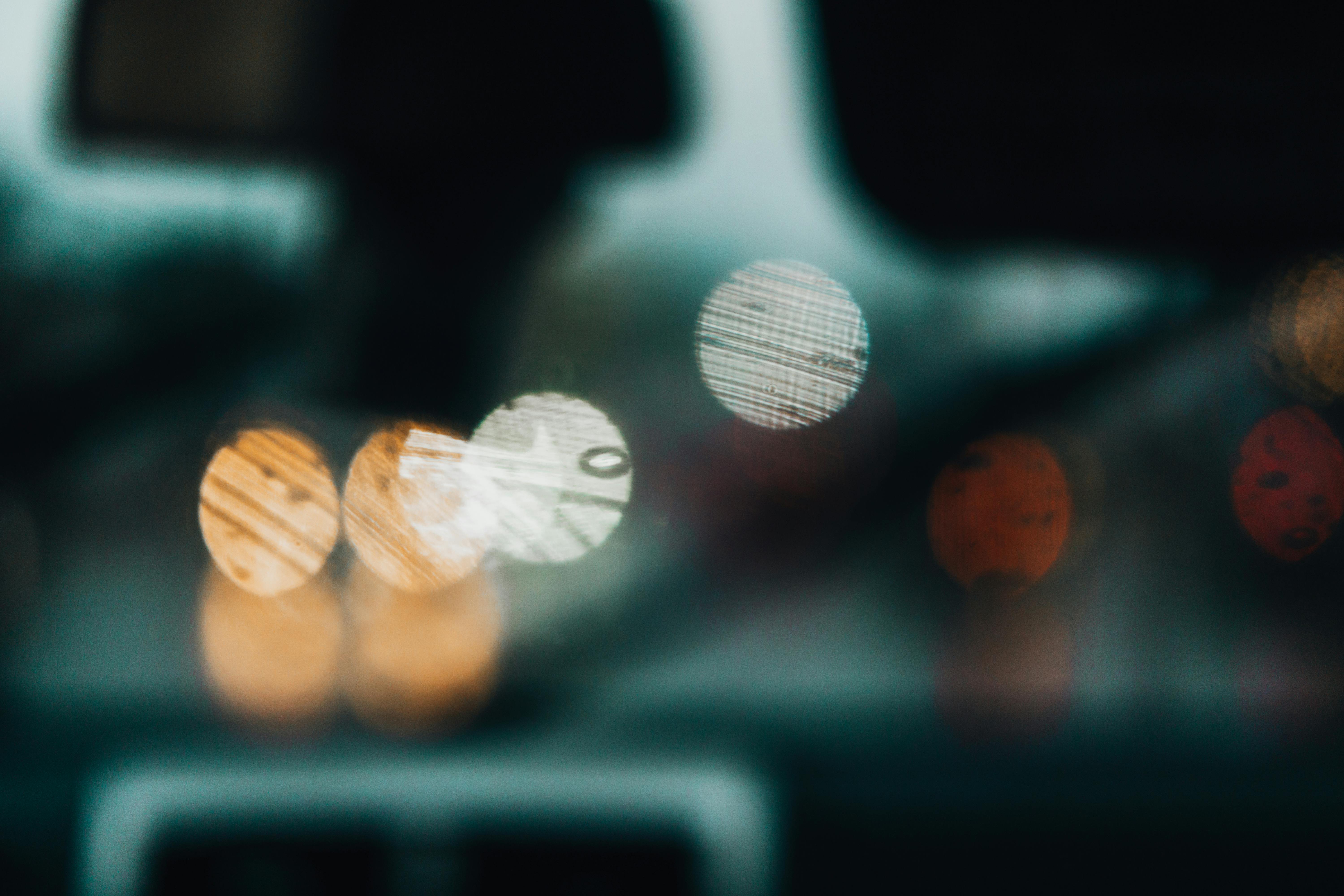 Free Blurred city lights creating bokeh through a car windshield for an artistic and abstract effect. Stock Photo