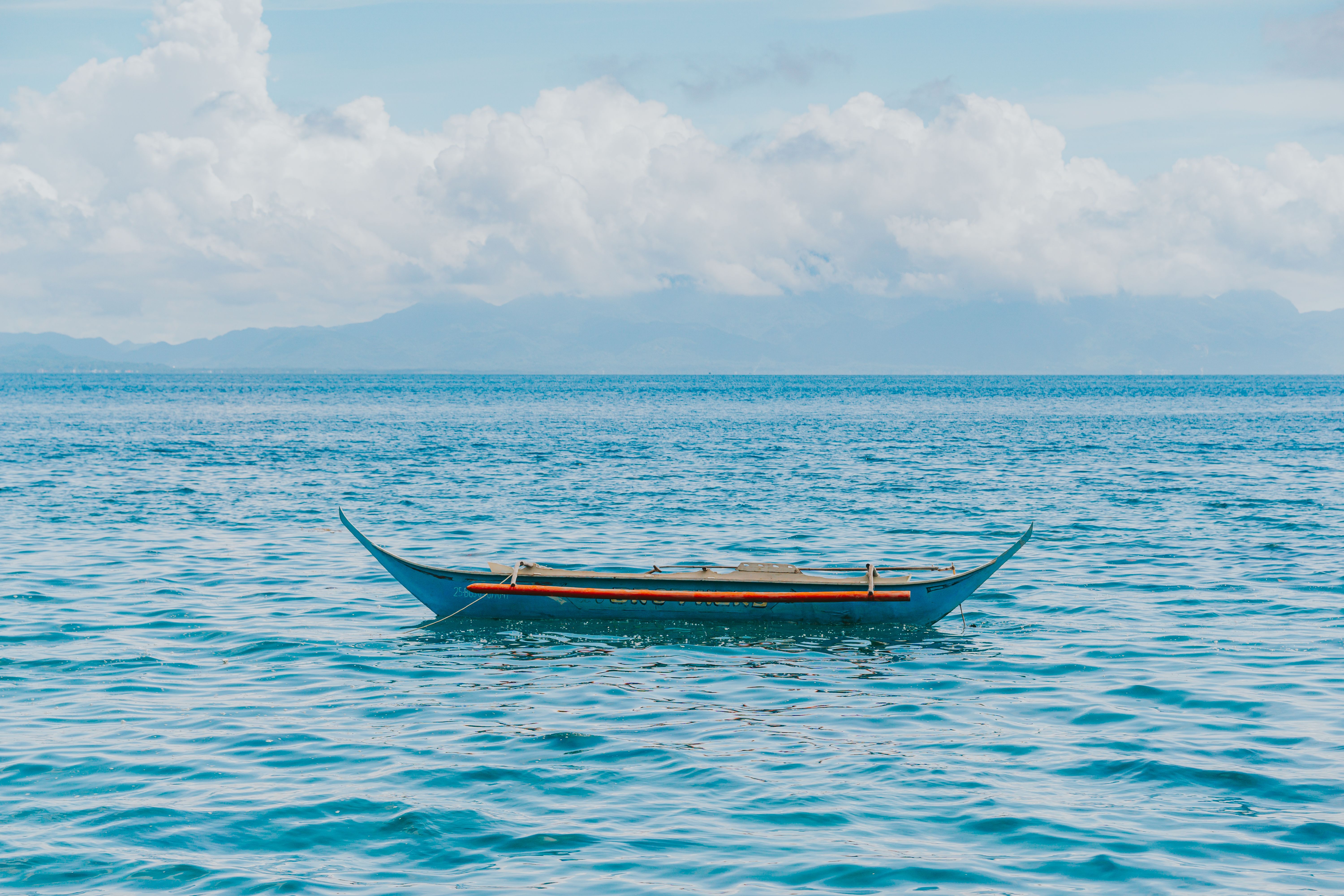 Traditional Guna Yala boat on the turquoise waters of the San Blas Islands, Panama