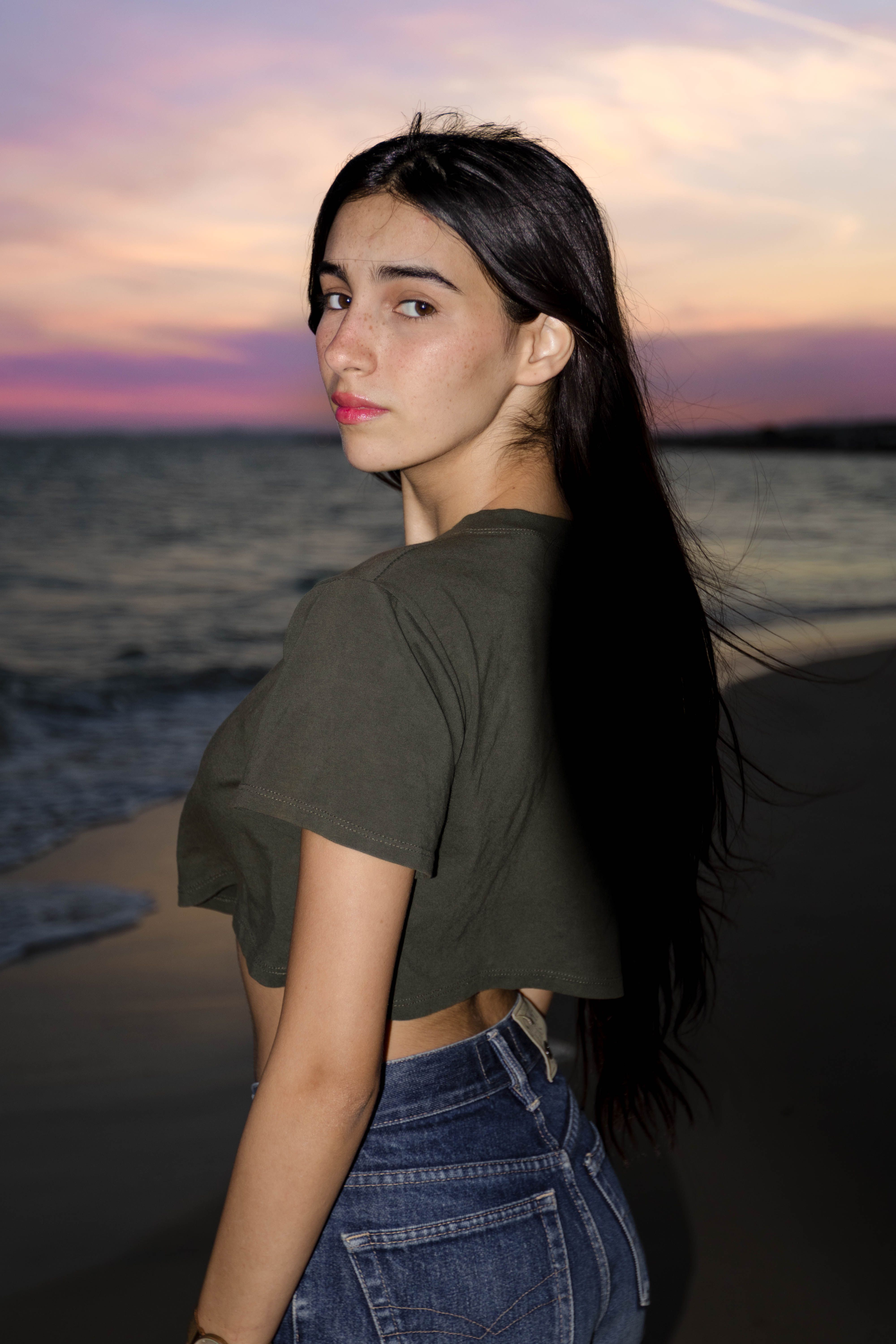 Portrait of a Woman at the Beach at Sunset · Free Stock Photo