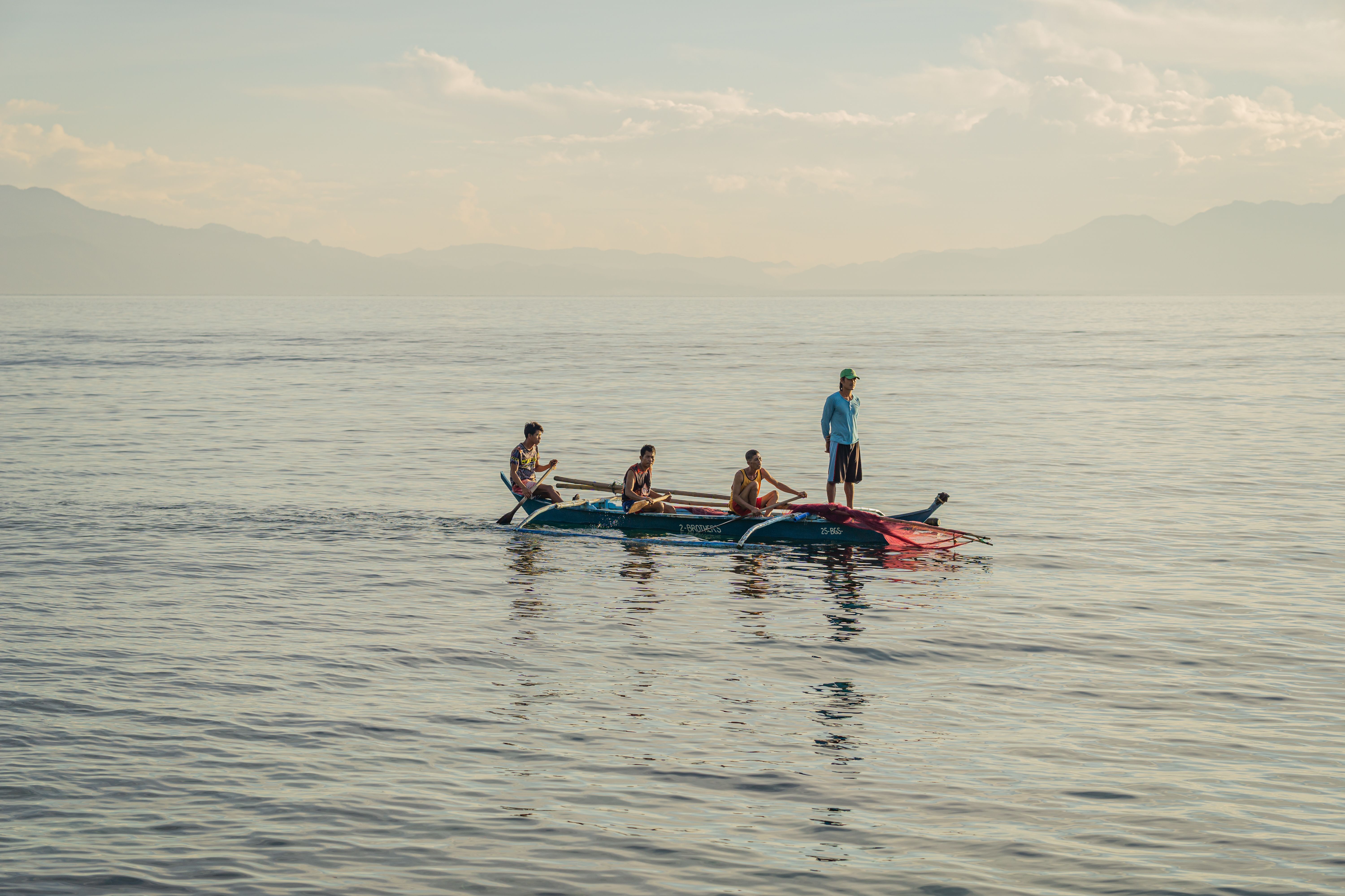 Group Enjoying Kayaking Adventure at Sea · Free Stock Photo