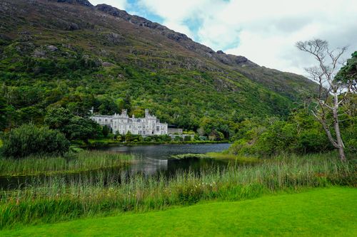 Free Enchanting landscape with Kylemore Abbey and lush greenery in Ireland. Stock Photo