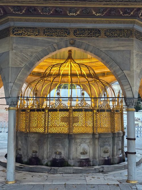 Free Ornate fountain with golden grillwork in Istanbul, blending history and art. Stock Photo