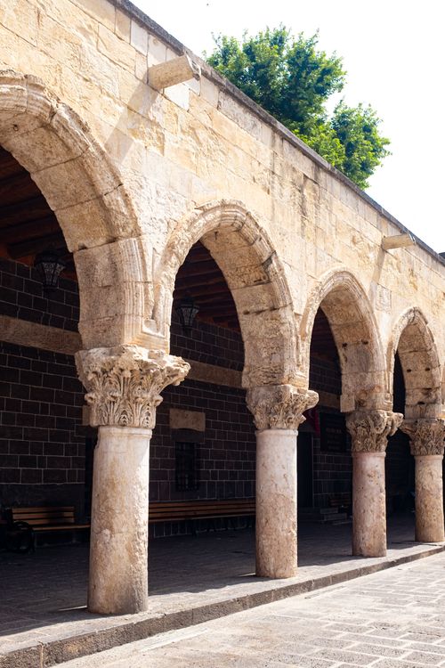 Free Beautiful stone arches in a historic setting with intricate details and natural lighting. Stock Photo